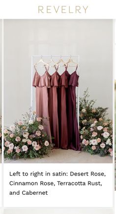 three dresses hanging on a rack with flowers and greenery in the foreground, text reads left to right in satin - desert rose, cinnamon rose, terracotta rust, and cabernet