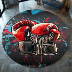 a round rug with two boxing gloves painted on it