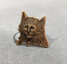 "Do you even know what a cat looks like?" This medieval kitty/grumpy human is the perfect ring for anyone who's ever seen a cat...Vintage Brass Stamping set on sterling silver band. The band is 5mm wide and 1 mm thick, the cat is 12x13 mm in size and about 1 mm thick. Made to order, just include ring size between 4-9 Elegant Cat Design Jewelry Ring, Silver Cat Design Ring, Novelty Black Cat Design Jewelry, Vintage Jewelry Cats, Vintage Silver Cat Design Jewelry, Sterling Silver Bands, Perfect Ring, Silver Band, Sterling Ring