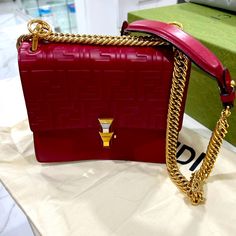 Excellent Condition The Only Call Out Is Inside Has Some Red Lipstick (See Picture For Details ) Outside No Sign Of Wear , I Only Used 5 Days In Vegas And I Never Used Again, Comes With Dust Bag Designer Red Rectangular Case Bag, Red Fendi Bag, High-end Red Rectangular Box Bag, Luxury Red Bag With Gold-tone Hardware, Fendi Fendigraphy Bag, No Sign, Red Lipstick, Fendi Bags, Mini Bag