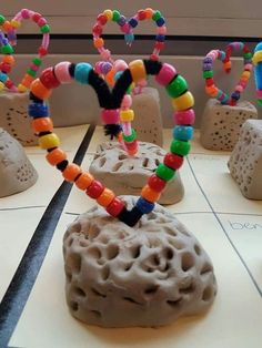 an art project made out of clay and beads