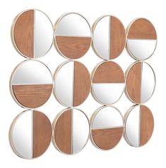 six circular mirrors with different shapes and sizes on the wall, all made out of wood