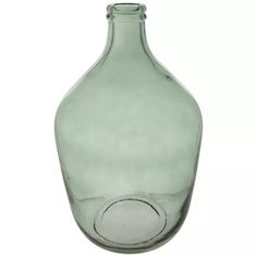 an empty green glass bottle on a white background