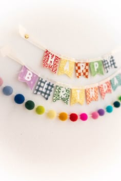 colorful birthday buntings are hanging on the wall