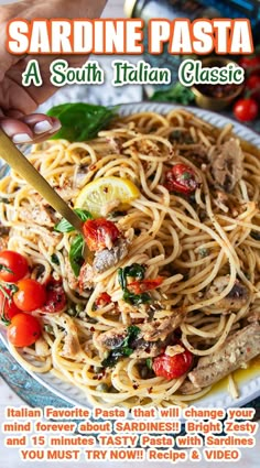 a plate of pasta with tomatoes and basil on it, next to a hand holding a knife