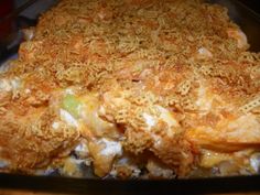 a casserole dish with meat and cheese on it in a glass pan, ready to be eaten