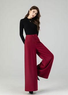 "Discover contemporary winter chic in our burgundy wide-leg high-waisted wool pants. Crafted with care from luxurious wool, these full-length trousers offer the ultimate combination of fashion and warmth. Their wide-leg silhouette adapts to various occasions, and the deep wine-red shade radiates timeless elegance. Whether you're headed to work or a festive event, these wool pants ensure you're both stylish and cozy. DETAIL * 30% wool blend, 40% fiber and polyester, 40% nylon * Full polyester lining * Two side pockets * Zipper and button front closure * Wide leg pants * High waisted Pants * Perfect for summer, autumn and spring * Dry clean MODEL SIZE Bust 85 cm(33.4\") Waist 67 cm(26.7\") Height 168cm (5' 6\") She wears size XS Choose CUSTOM Order if you * Need a better fit * Can't find you Luxury Wool Wide Leg Pants For Fall, Luxury Wool Wide Leg Formal Pants, Luxury Wool Wide Leg Pants For Spring, Luxury Wool Dress Pants For Fall, Chic Luxury Wool Bottoms, Luxury Wool Pants For Winter, Luxury Wool Pants For Formal Occasions, Chic Luxury Wool Dress Pants, Luxury Wide-leg Winter Bottoms