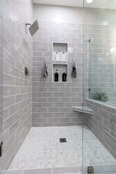 a walk in shower sitting next to a toilet