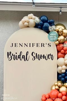 a bridal shower sign is decorated with balloons