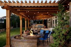 an outdoor patio with fire pit and seating area