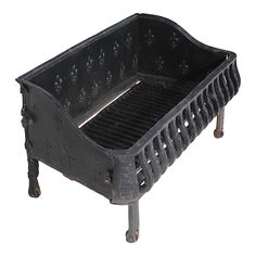 an old cast iron grate sitting on top of a table