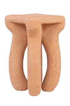 a small stool made out of clay with two curved legs on the top and bottom