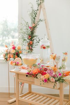 a table with flowers and drinks on it