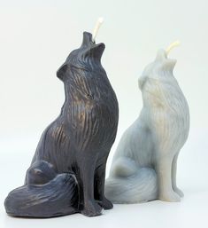 two ceramic animals sitting next to each other