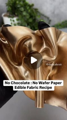 a person holding a gold mask in their hand with the words no chocolate no wafer paper edible fabric recipe