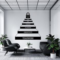 a black and white photo of a pyramid wall decal with the words teamwork on it