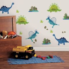 a child's bedroom with dinosaur wall decals and toy trucks on the floor