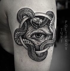 a black and white tattoo with an all seeing eye