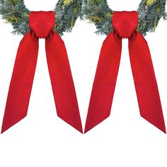 two christmas wreaths with red bows and pine cones