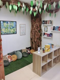 an office decorated with paper leaves and cat beds