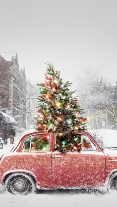 a small red car with a christmas tree on top