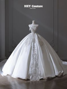 a wedding dress on display with the words hey couture written in white lettering