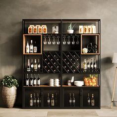 a wine rack filled with lots of bottles and glasses next to a potted plant