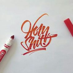 a red marker and some writing on a white paper