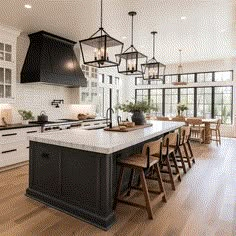 a large kitchen with an island in the middle