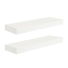 two white shelves sitting next to each other