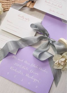 the wedding stationery was done in shades of lavender and silver, with matching calligraphy