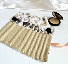 "This trendy, and useful, bee and polka dot print makeup brush roll is the perfect gift! Each roll is complete with a coordinating tie ribbon, top flap to cover brushes, and 12 various sized brush slots. Useful for holding your brushes everyday or specifically for travel. Made for makeup brushes but can be used for crochet hooks, pencils, paint brushes, and more. Made specifically to fit inside Simply Stitched Styles cosmetic bags.  Treat yourself with this makeup roll or gift this at a birthday party, bridal shower, baby shower, Christmas party, or just because! Measuring 9.5\"  x 11\" Care: - machine wash on a gentle cycle with cold water - lay flat to dry and press with an iron to remove wrinkles on a low heat setting -Check out Simply Stitched Styles other listings for matching keychai Paint Brush Roll, Crochet Hook Roll, Makeup Brush Roll, Ribbon Top, Diy Travel Bag, Baby Shower Christmas, Makeup Organizers, Tie Ribbon, Makeup Brush Holder