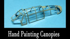 a close up of a metal object on a blue background with the words hand painting campies