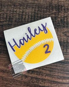 a sticker with the name haleys on it and a softball ball in the middle