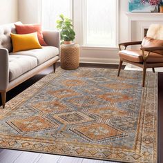 a living room with a couch, chair and rug