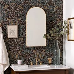 a bathroom with a sink and mirror in it