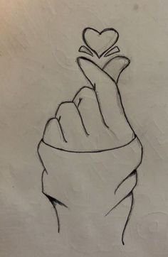 a drawing of a hand with a heart on it