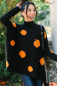 We think it's going to be a quick decision for you to put this cute sweater in your cart! It's obviously super cute with that pumpkin print but it's also super cozy making it perfect for the fall! This mock neck sweater is going to look so cute with skinny jeans and boots or booties! Mock neckline Long fitted sleeves with drop shoulders Side slits Pumpkin print Generous stretch Cindy is wearing the small. Pumpkin Sweater, Black Pumpkin, Floral Cocktail Dress, Black Tie Dress, Long Sleeve Outerwear, Girl's Back, Cute Spring Outfits, Girls Graphic Tee, Cute Sweater