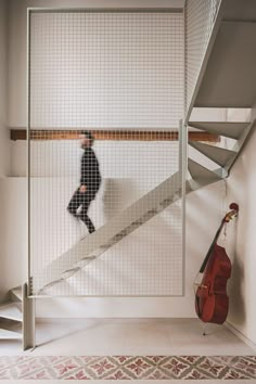 a man is walking up the stairs in front of an instrument