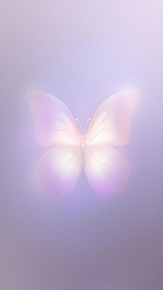 a white butterfly flying through the air on a foggy day