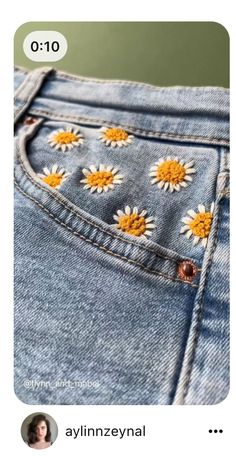 the back side of a pair of jeans with daisies on them, and an instagram