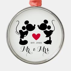 mickey and minnie wedding ornament with red heart on it's back,