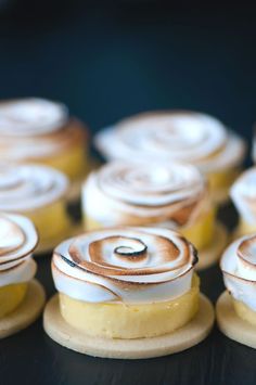 some food that is sitting on top of a black table and it looks like they are rolled up