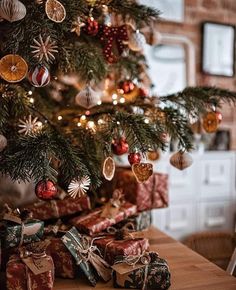 a christmas tree with presents under it