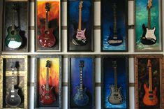 an assortment of guitars are displayed on the wall