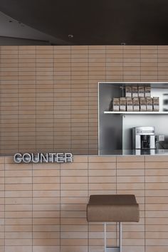 the counter and stools are in front of the counter