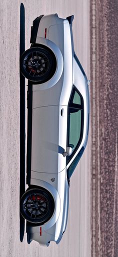 the top view of a silver car parked in a parking lot