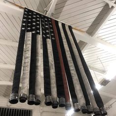 an american flag made out of skis hanging from the ceiling