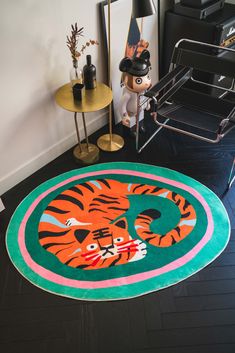 a rug with an image of a tiger on it in the middle of a room