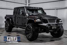 a black jeep is parked in a garage